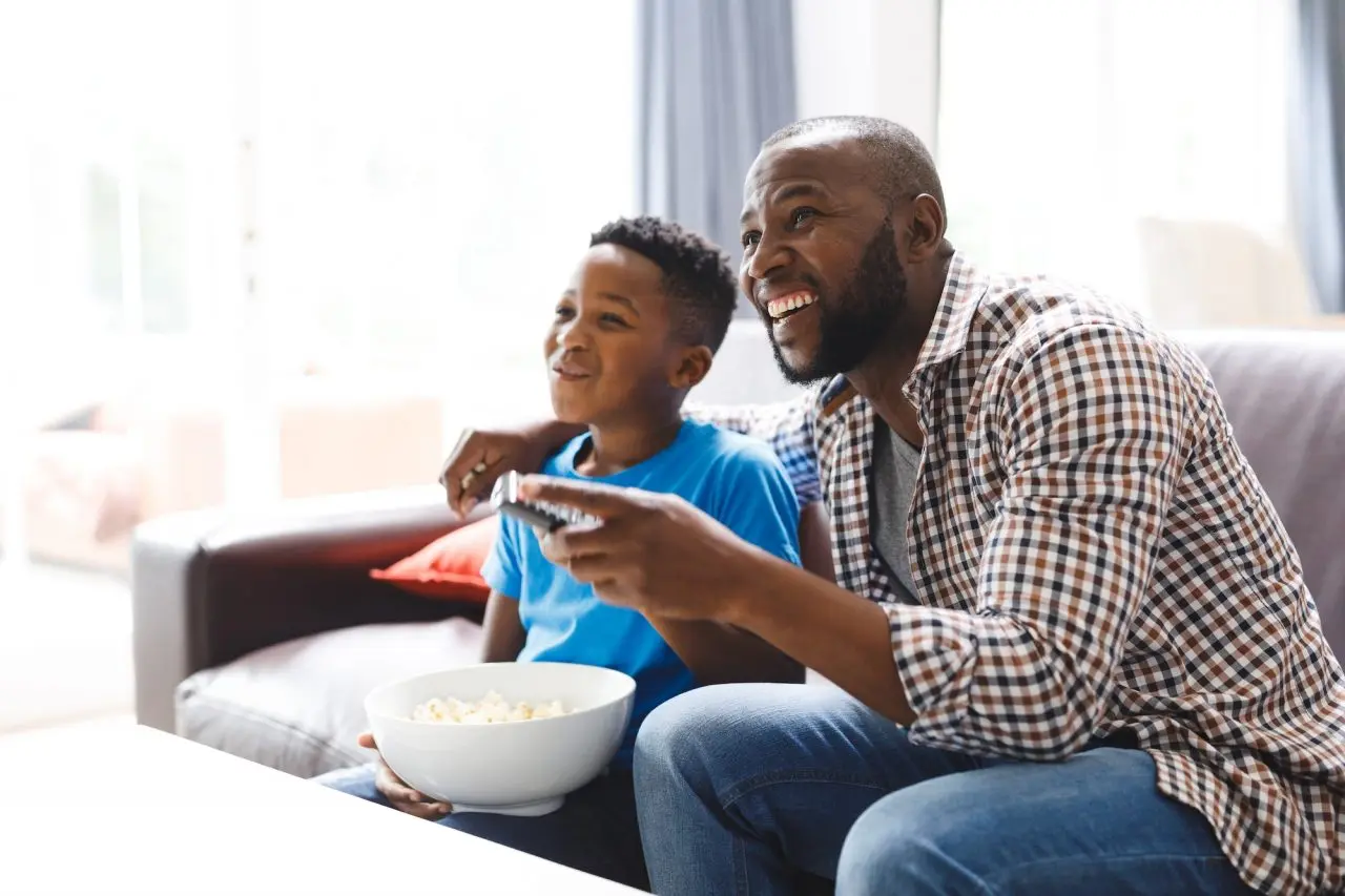 father and son watching swiftstreamer TV service
